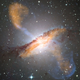 Illustration for article titled Black hole shoots out plasma jets that are even bigger than its galaxy
